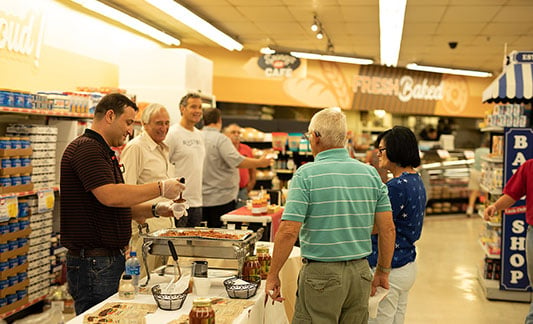 Shoppers at tasting event in grocery store