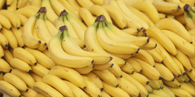 bananas stacked for sale